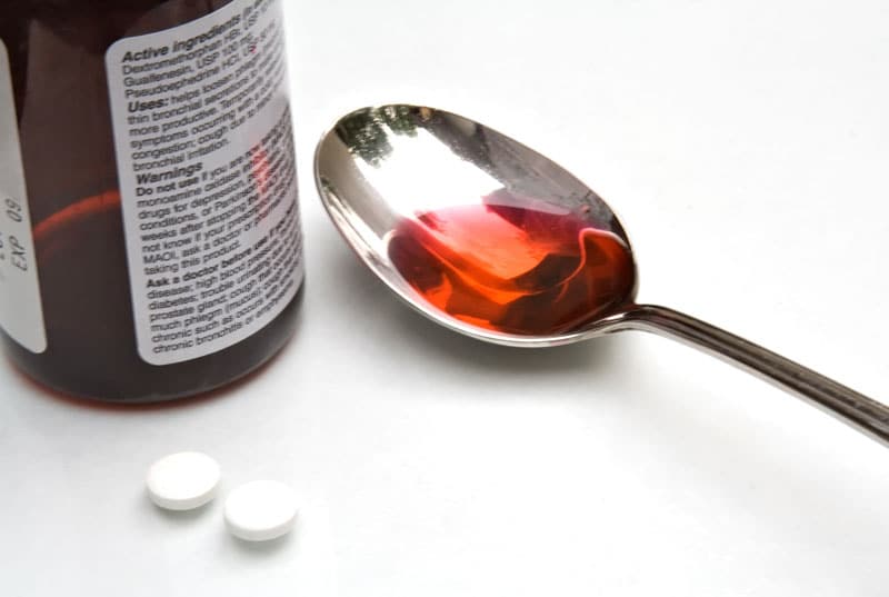 Cough medicine in a metal spoon