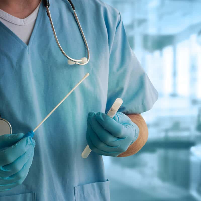 A woman gives an Oral Fluid Sample